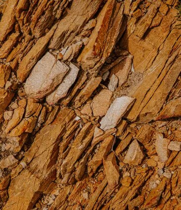 A close up of Château Galoupet Cru Classé Côtes de Provence terroir composed of terracotta quartzphyllite, shale sandstone and collovium.