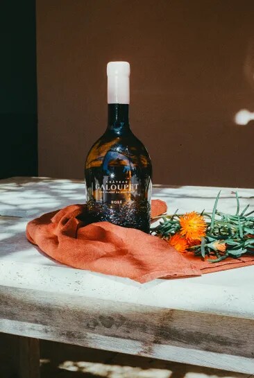 Someone tasting Château Galoupet Natural Rosé Wine