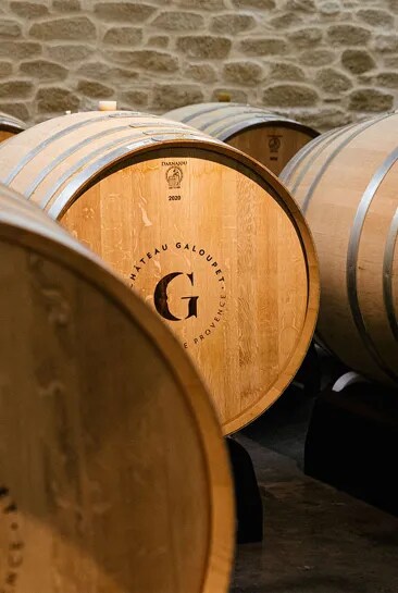 Organic wine ageing in big oak barrel in the cellars of Château Galoupet Cru Classé Côtes de Provence.